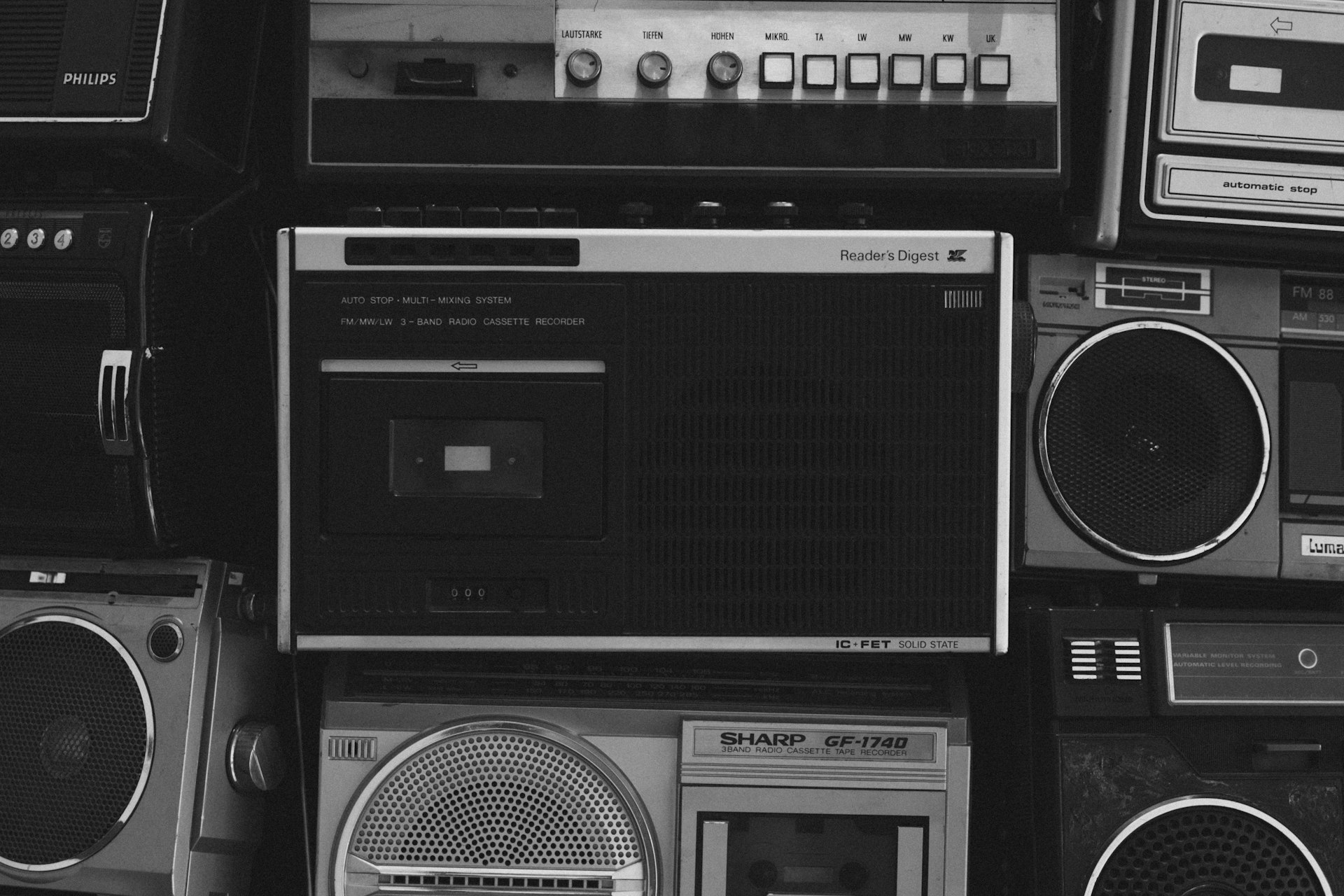 A black and white photo of old radio's